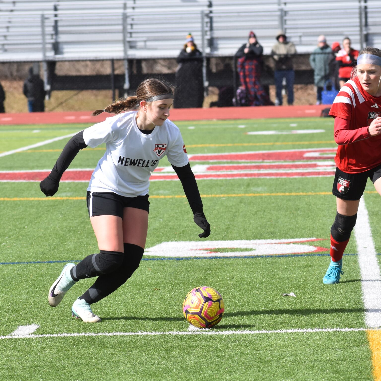Vale Newell’s girls player driving forward with the ball